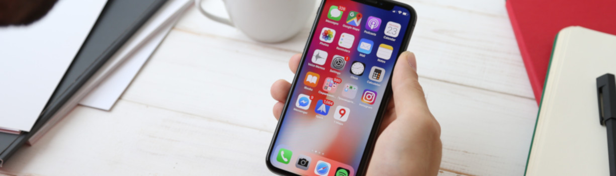 man holding iphone in hand app