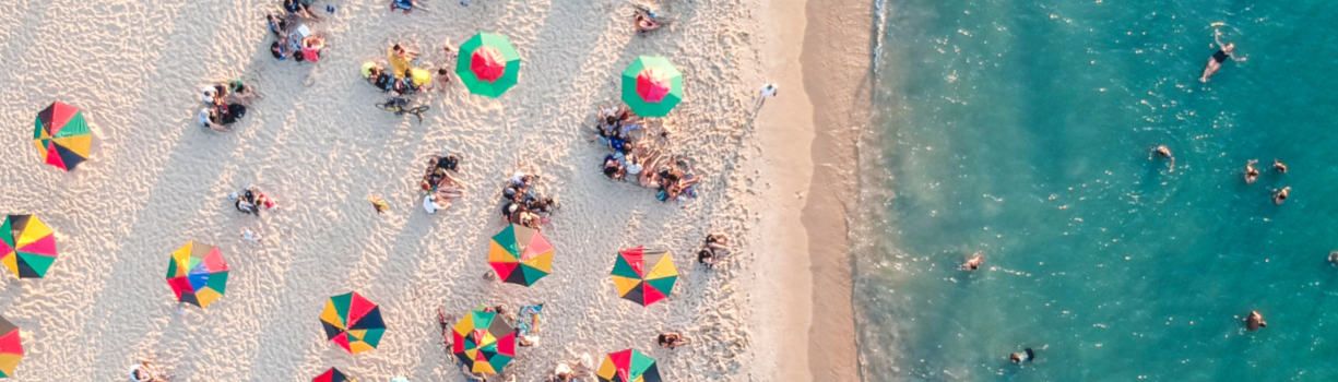people laying in the sun beach